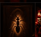 Ant emblem artwork lit on the wall