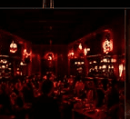 Guests seated in the dining room under warm light