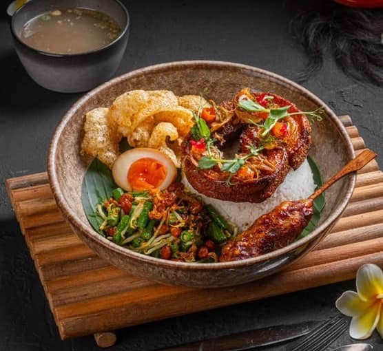 Balinese porchetta rice with crispy pork cracklings and sambal embe