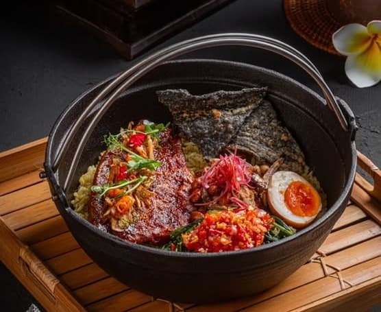 Jimbaran barramundi claypot rice with crispy teri, peanuts and sambal matah